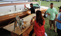Beer festival serving up ice cold beverages via a tap truck. The beer truck in the form of a 1969 gmc panel truck